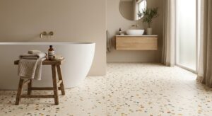 Carrelage effet terrazzo au sol dans une salle de bain moderne aux tons clairs